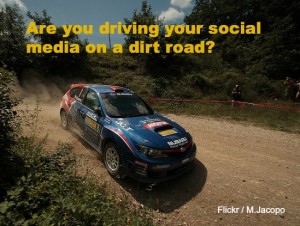 Sports car (social media) driving on dirt road (old website)